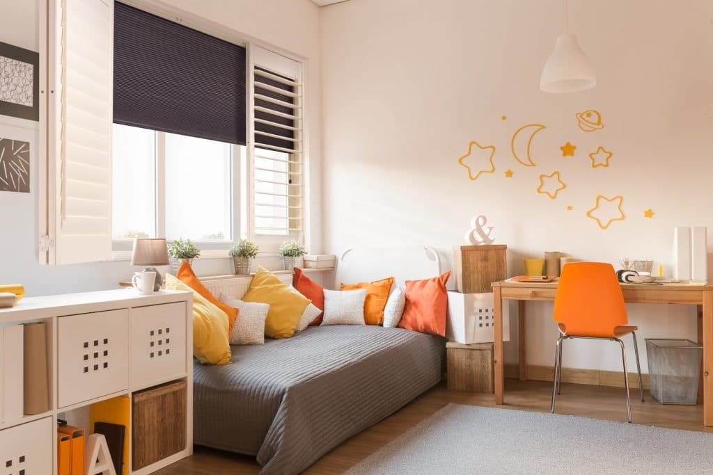 Shutter and shade in orange bedroom