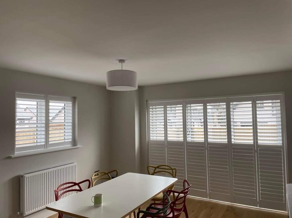 White blinds in dining room